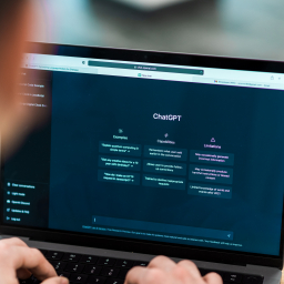 seorang pria sedang membuka laptop dengan tampila open ai chatgpt